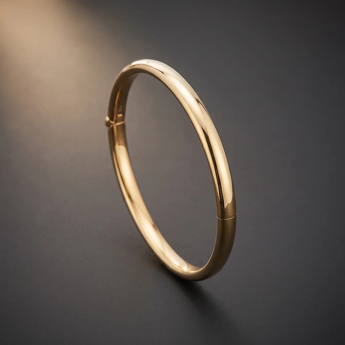 Aria Bangle — Polished hinged bangle, rounded profile, 18k gold.