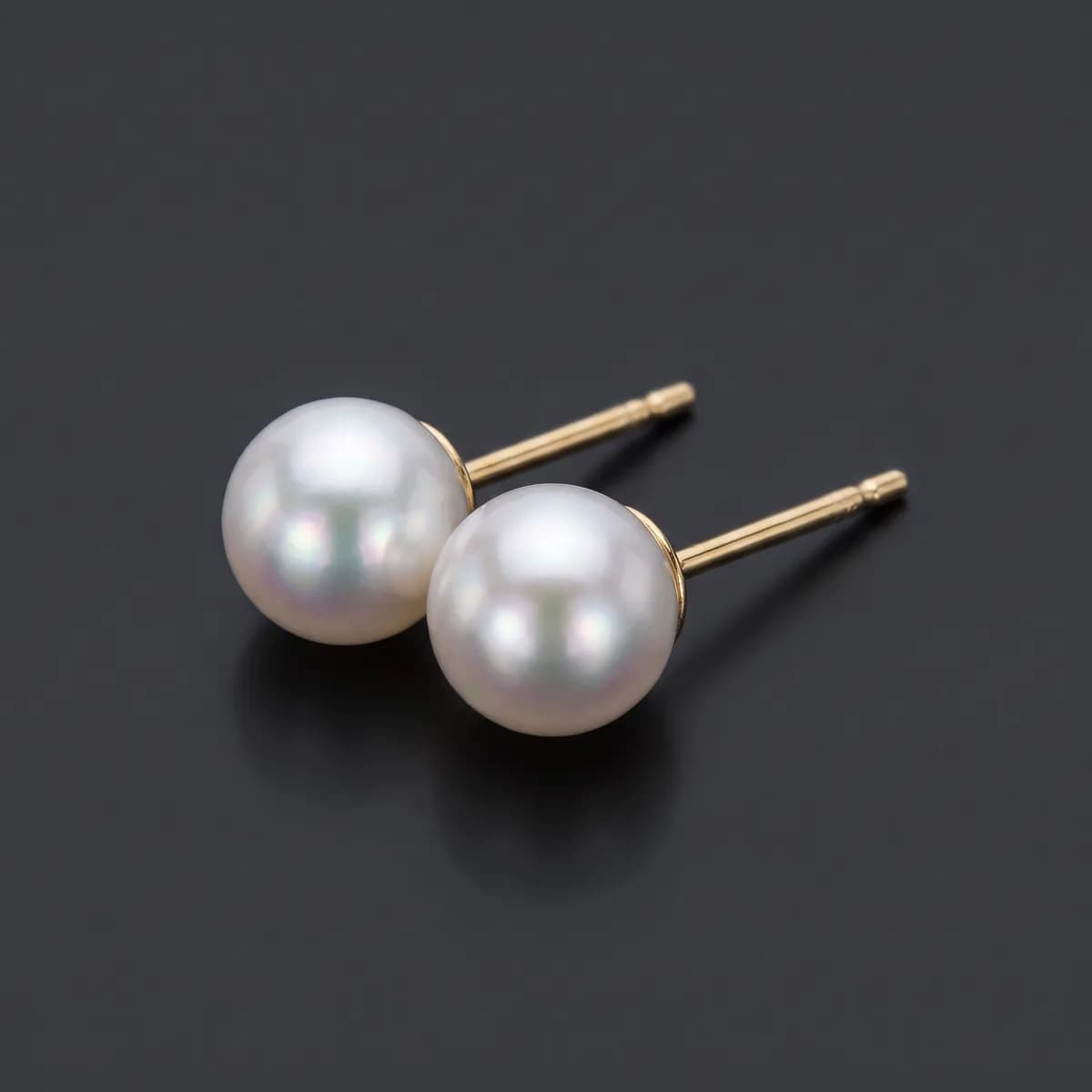 Halcyon Studs — Matched Akoya pearls on slim gold posts.