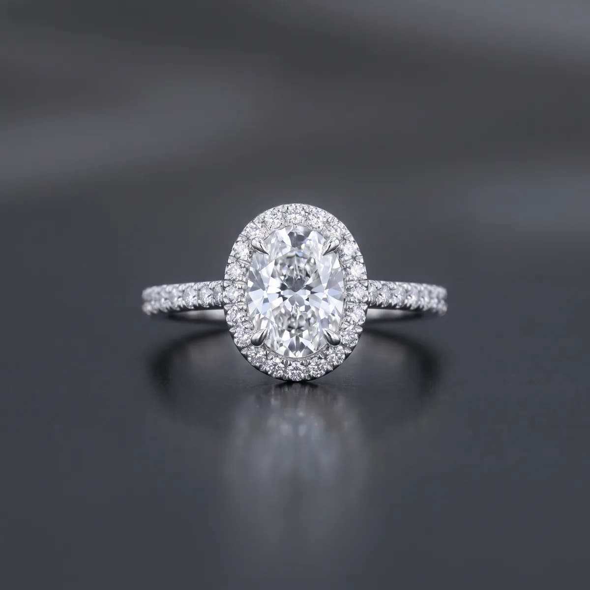 Lumière Halo — Oval centre stone in a pavé halo, platinum.