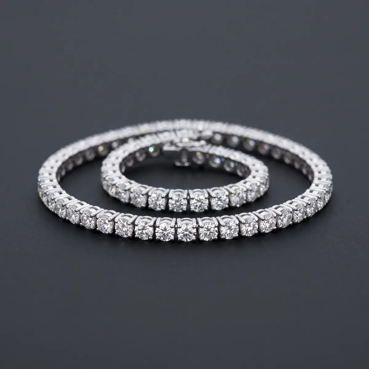 Meridian Tennis — Continuous four-prong diamond line, 18k white gold.